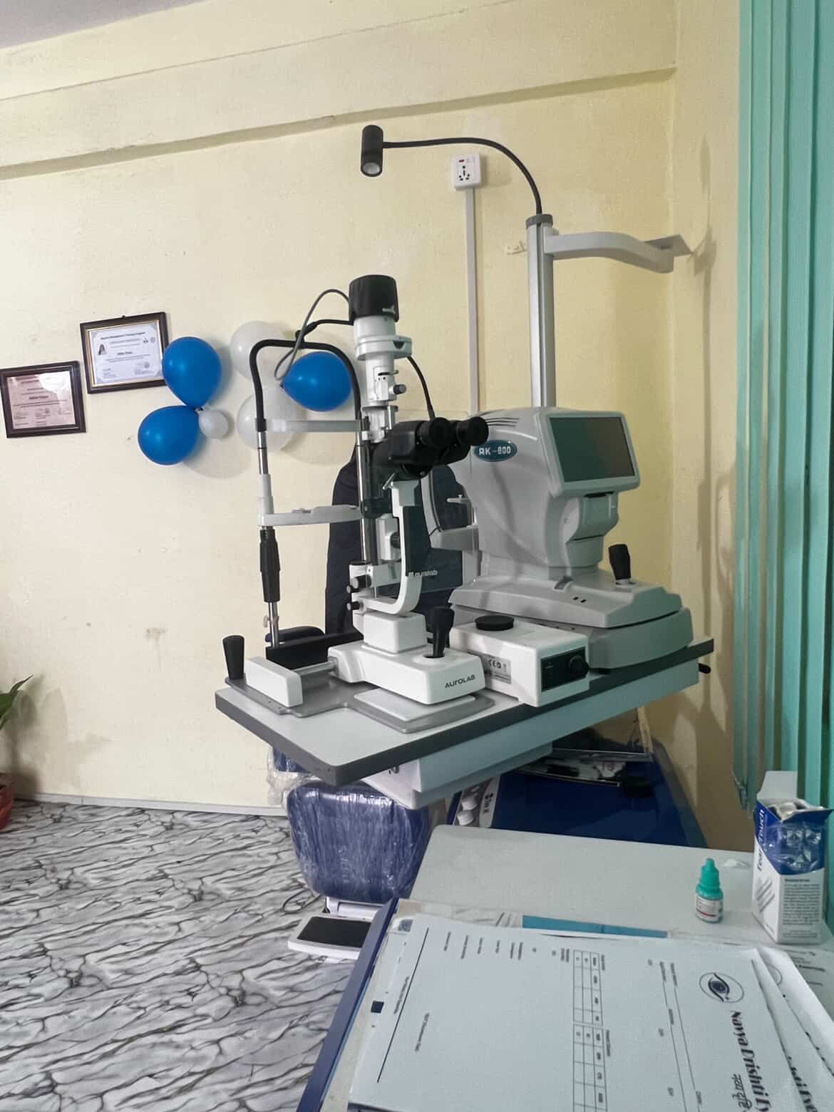 Nikita Thapa at Navya Drishti Eyecare clinic with diagnostic equipment
